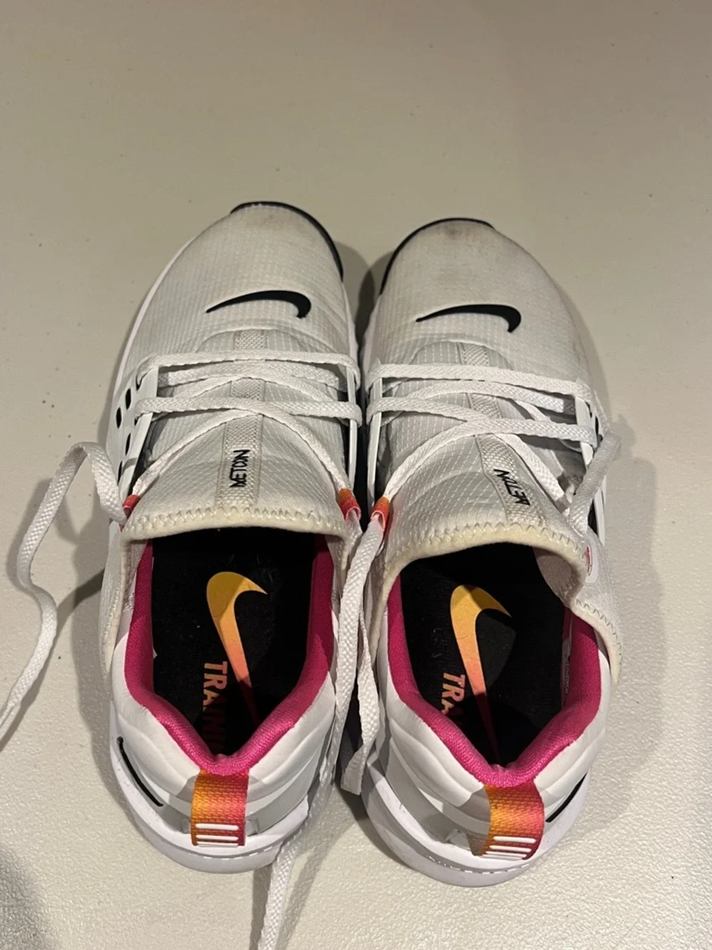 Nike White Metcon Training Shoes with Black Swoosh and Pink/Orange Pull Tabs
